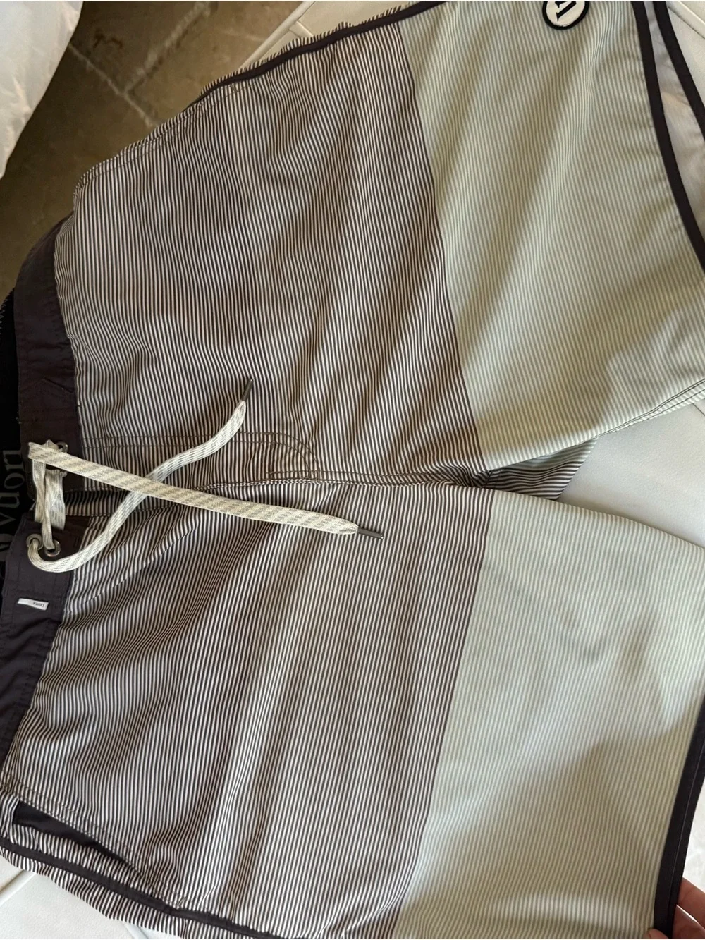Vuori Men's Pinstripe Swim Board Shorts in Light Gray and Brown Trim